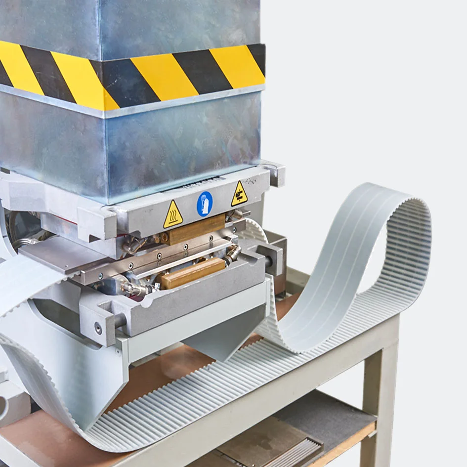 Welded timing belts manufacturing machine